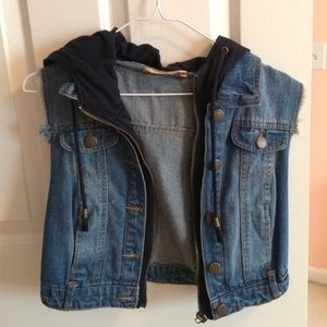 A cropped jean vest with Navy blue hood.