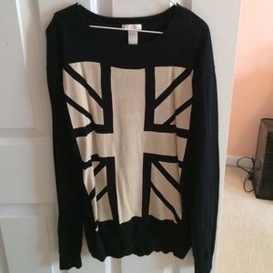 Long creme and black sweater.