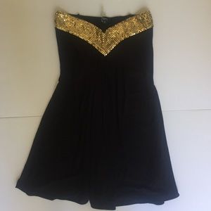 Gorgeous gold and black strapless Sky top