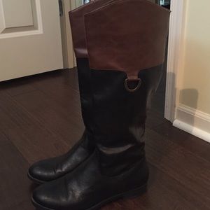 Black and brown tall boots