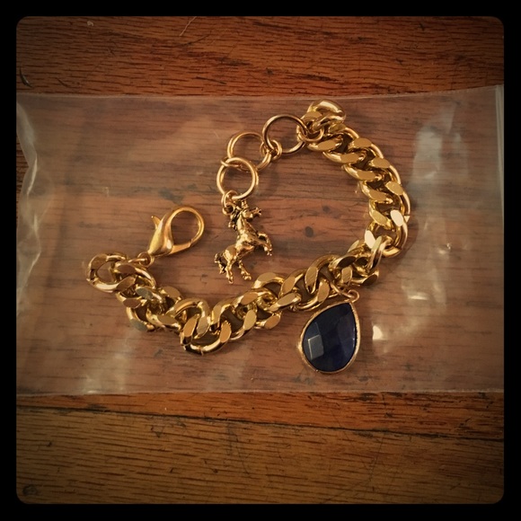 Gold unicorn and blue stone charm bracelet