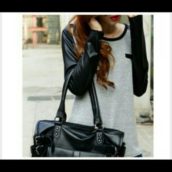 Grey shirt with leather sleeves.