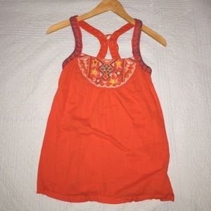 Orange/red Aztec print top with a cute back cutout