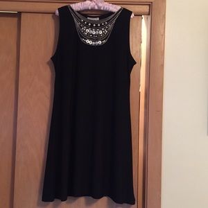 Sleeveless black dress with mock necklace