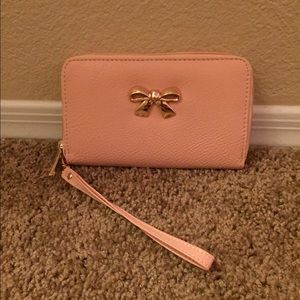 Pink wristlet/wallet with gold bow