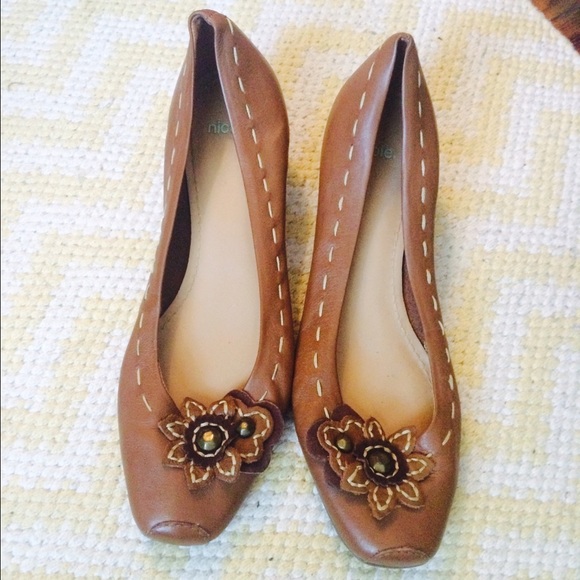 Brown low wedge shoes.