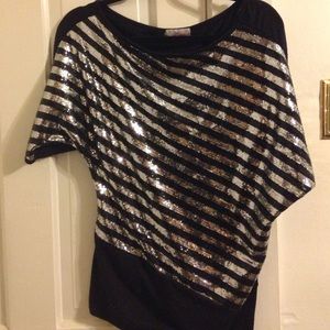 Silver sequined shirt.