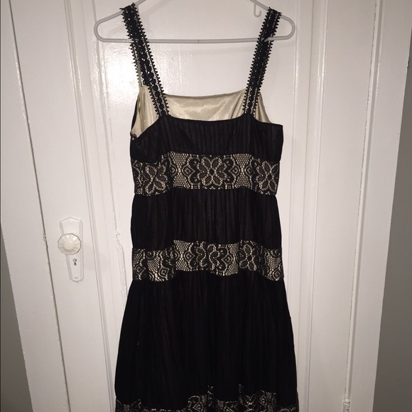 Black dress with detailed lace and nude underlay