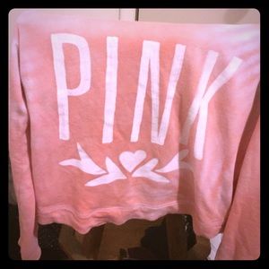 A coral colored pink long sleeve shirt