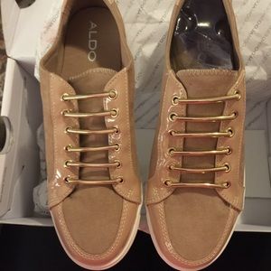 ALDO beige with gold sneakers / shoes.