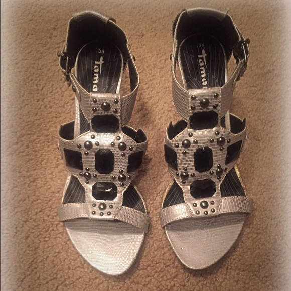 Gray and black leather sandals.