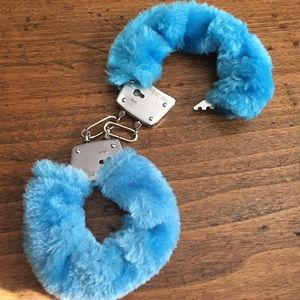 Neon blue furry handcuffs. NEVER USED.
