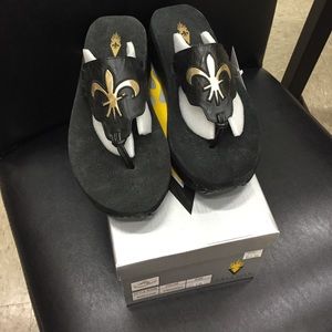 Black and Gold Volatile Flip Flops