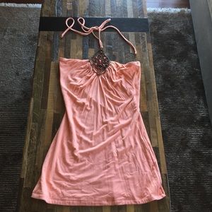 Pink top with embellishment between bust