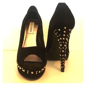 Black suede peep toe pumps with studded heals