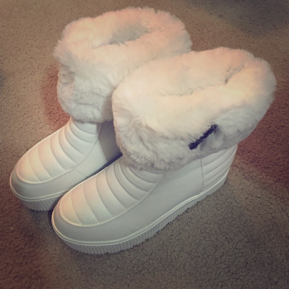 Shoes - White water proof furry boots with hidden heels.