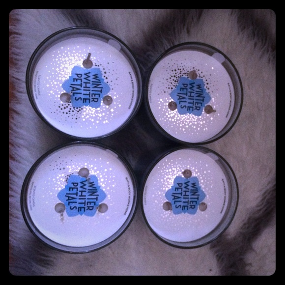 4 winter white petals candles from bath and body.