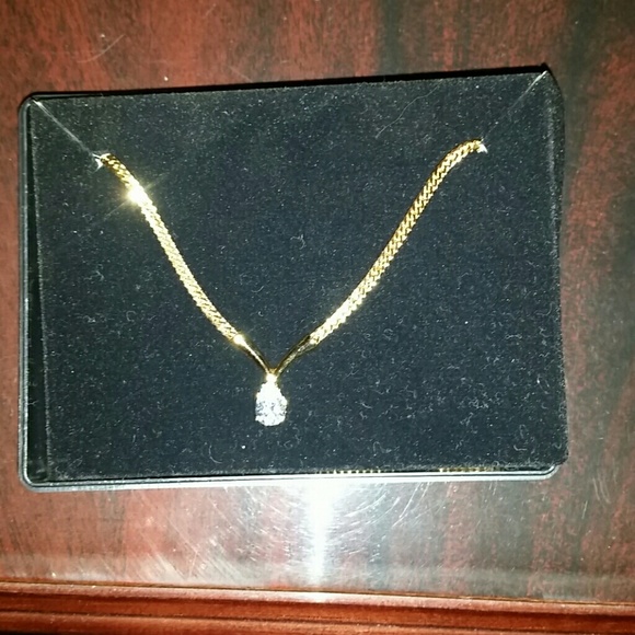Gold diamond pendant necklace.