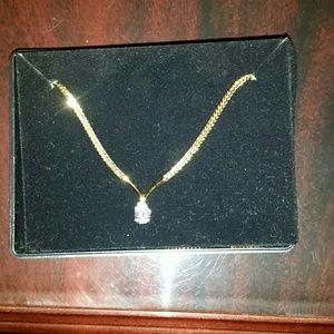 Gold diamond pendant necklace.