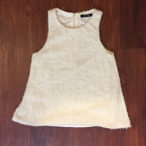 Sleeveless white fuzzy sweater