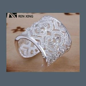 Silver heart ring with inlaid stones