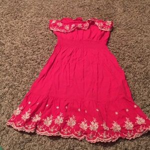 Pink dress, with cute white flowers and lace.