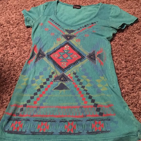 Light blue shirt with tribal printing.