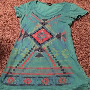 Light blue shirt with tribal printing.