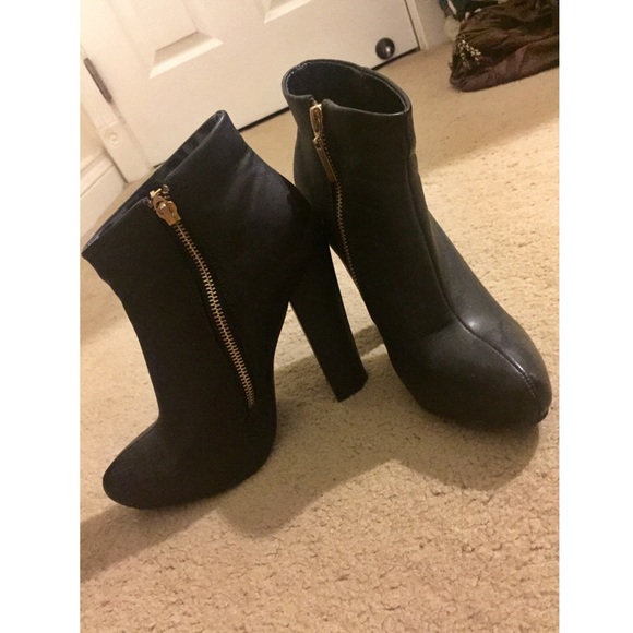 Express black booties with gold zipper