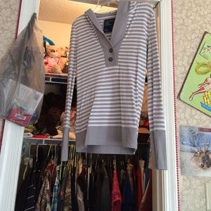 Long sleeve, hooded shirt.