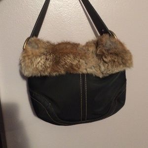 Black nylon Coach bag with fur trim