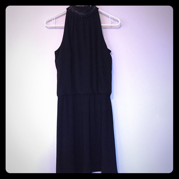 Sleek black dress with choker detail.