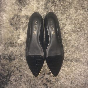 Classy black flats with gold detail!