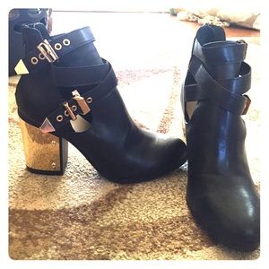 Black booties with gold heels