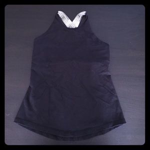 Black lulu tank with white straps.