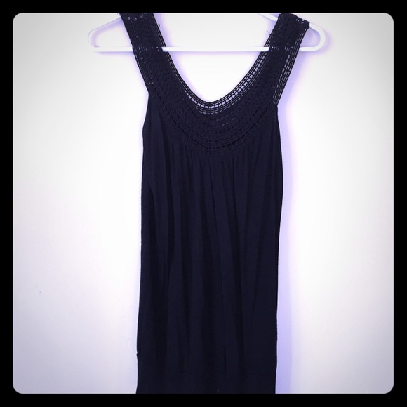 Black tank top with lace straps.