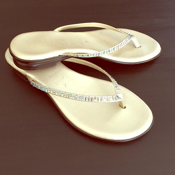 Gold sandals with jewel accent