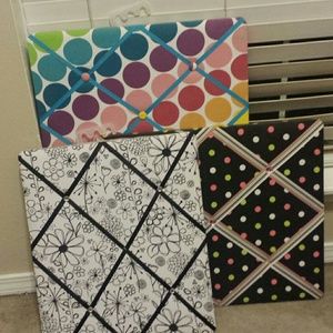 Three boards that hold pichures