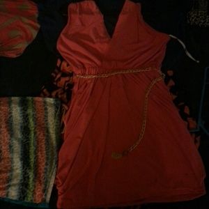 Pink tight dress with gold chain around the waist