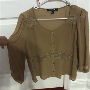 Large, sheer tan and lace blouse