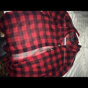 See through plaid black and red shirt.