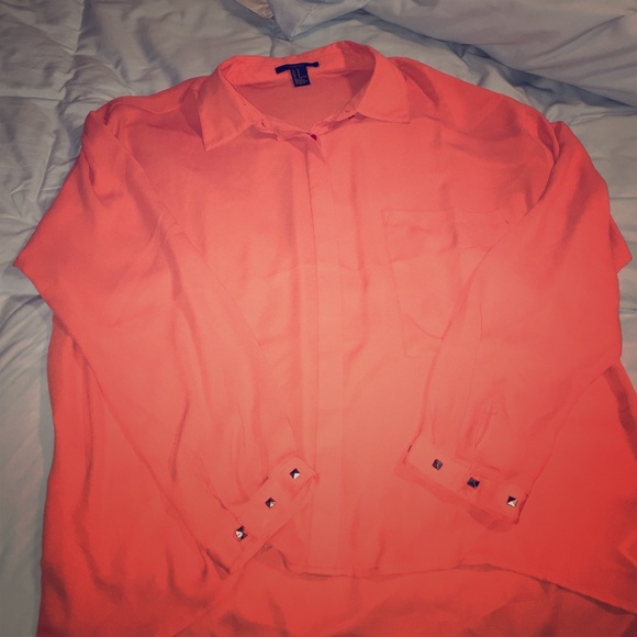 Orange blouse with studs on wrist
