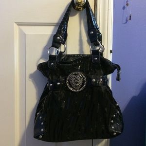 Medium sized purse. Not sure which brand.