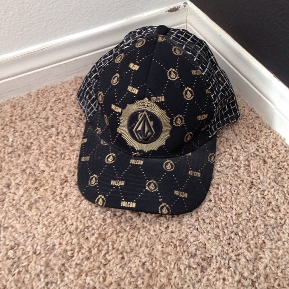 Black and gold volcom hat