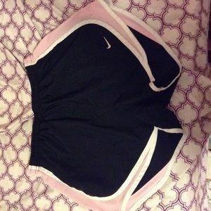 Pink and black Nike shorts