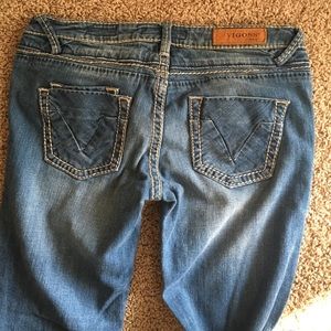 Medium light wash Vigoss collection jeans.