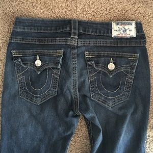 Dark wash True Religion jeans.