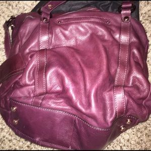 B. Makowsky bag in purple.