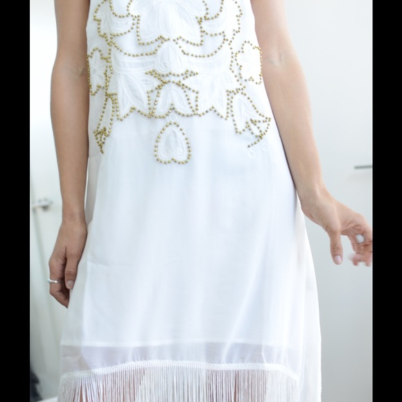 white beaded dress with gold beads