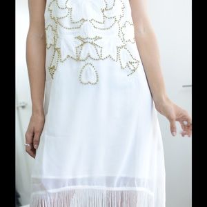 white beaded dress with gold beads